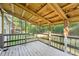 Relaxing screened porch with wooden decking at 1472 Fritts Ave, Fort Mill, SC 29715