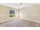 Spacious bedroom with ceiling fan and neutral decor at 1472 Fritts Ave, Fort Mill, SC 29715