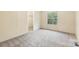 Bedroom with a window overlooking the backyard and a large closet at 1472 Fritts Ave, Fort Mill, SC 29715