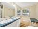 Bathroom with a double vanity, bathtub and large mirror at 1472 Fritts Ave, Fort Mill, SC 29715