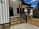 Stone steps leading to the front porch with a metal railing at 256 Houpe Rd, Statesville, NC 28625