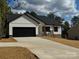 New construction home with a modern farmhouse style at 256 Houpe Rd, Statesville, NC 28625