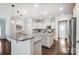 Modern kitchen featuring white cabinets and granite island at 5021 Henshaw Rd, Waxhaw, NC 28173