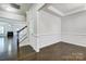 Bright foyer with dark hardwood floors and wainscoting at 5021 Henshaw Rd, Waxhaw, NC 28173