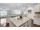 Kitchen island with granite countertop, perfect for casual dining at 5021 Henshaw Rd, Waxhaw, NC 28173