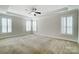 Bright and airy bedroom with plush carpeting and a ceiling fan at 5021 Henshaw Rd, Waxhaw, NC 28173