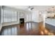 Open living space with hardwood floors and a fireplace at 5021 Henshaw Rd, Waxhaw, NC 28173