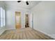 Spacious bedroom with neutral carpeting and plantation shutters at 5021 Henshaw Rd, Waxhaw, NC 28173