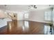 Spacious living room with hardwood floors and plantation shutters at 5021 Henshaw Rd, Waxhaw, NC 28173