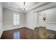 Formal dining room with hardwood floors, wainscoting, and a view of the foyer at 5021 Henshaw Rd, Waxhaw, NC 28173