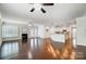 Open living room featuring hardwood floors and a fireplace at 5021 Henshaw Rd, Waxhaw, NC 28173