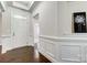 Spacious foyer with white door and wainscoting at 5021 Henshaw Rd, Waxhaw, NC 28173