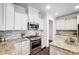 Modern kitchen featuring stainless steel appliances and granite countertops at 5021 Henshaw Rd, Waxhaw, NC 28173
