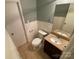 Small bathroom with toilet and granite vanity at 614 Kenlough Dr, Charlotte, NC 28209