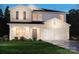 Two-story house featuring a brick and siding exterior, two-car garage, and landscaping at 109 Sentinel Ct, Mooresville, NC 28115