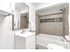 Clean bathroom with a bathtub/shower combo, modern fixtures, and tiled walls at 139 Ebenezer Ave, Rock Hill, SC 29730
