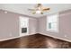 Spacious bedroom with wood-look flooring, ceiling fan, and connecting access to a bathroom at 139 Ebenezer Ave, Rock Hill, SC 29730