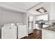 Kitchen with white cabinets, stainless steel appliances, and a washer and dryer at 139 Ebenezer Ave, Rock Hill, SC 29730