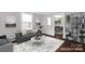 Virtually staged living room with a gray sofa, patterned rug, and view of the dining area at 139 Ebenezer Ave, Rock Hill, SC 29730