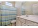 Clean bathroom with vanity, shower, and striped shower curtain at 151 Glade Valley Ave, Mooresville, NC 28117