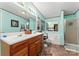 Bathroom features double vanity and a soaking tub at 335 Red Rose Ln, Mooresville, NC 28115