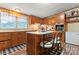 Kitchen with island, wood cabinets and stainless steel appliances at 335 Red Rose Ln, Mooresville, NC 28115