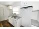 Renovated kitchen featuring granite countertops and white cabinets at 125 S Ervin Ave, Newton, NC 28658