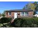 Brick ranch home with a white door, steps, and landscaping at 125 S Ervin Ave, Newton, NC 28658