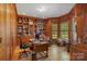 Spacious home office with built-in bookshelves and hardwood floors at 18212 Pompano Pl, Cornelius, NC 28031