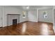 Bright living room with hardwood floors, fireplace, and large windows at 710 Packard Ave, Kannapolis, NC 28083