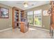 Bright home office features built-in shelving and large windows at 6859 Lakecrest Ct, Denver, NC 28037
