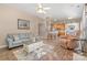 Open living room with a view into kitchen, hardwood floors at 6859 Lakecrest Ct, Denver, NC 28037