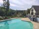 Community pool with clubhouse and lake view at 6859 Lakecrest Ct, Denver, NC 28037