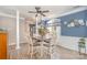 Bright dining room with wood floors and blue walls at 6859 Lakecrest Ct, Denver, NC 28037