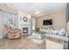 Cozy living room with fireplace, hardwood floors and large windows at 6859 Lakecrest Ct, Denver, NC 28037