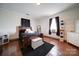 Bright bedroom with a dark wood bed frame at 103 Brent St, Wadesboro, NC 28170