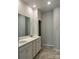 Double vanity bathroom with white cabinets and tiled floors at 1040 Bull Dog Ln, Wingate, NC 28174