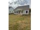 New construction home with covered patio and grassy backyard at 1040 Bull Dog Ln, Wingate, NC 28174