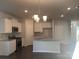 Modern kitchen featuring white cabinets, granite countertops, and an island at 1040 Bull Dog Ln # 37, Wingate, NC 28174