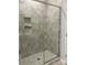 Clean shower with gray tiled walls and glass enclosure at 1040 Bull Dog Ln, Wingate, NC 28174