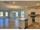 Open concept kitchen with island, stainless steel appliances, and white cabinetry at 1044 Bull Dog Ln, Wingate, NC 28174