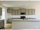 Modern kitchen featuring gray cabinets, granite countertops, and an island at 1053 Bull Dog Ln, Wingate, NC 28174