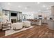 Open living area with fireplace, hardwood floors, and kitchen views at 1053 Bull Dog Ln, Wingate, NC 28174