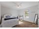 Spacious bedroom with a queen bed, carpet, and ceiling fan at 309 Commodore Loop, Mooresville, NC 28117