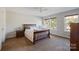 Bedroom with wood bed frame and carpeted floors at 309 Commodore Loop, Mooresville, NC 28117