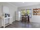 Kitchen features breakfast bar and white cabinets at 309 Commodore Loop, Mooresville, NC 28117