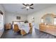 Main bedroom with wood furniture and ceiling fan at 309 Commodore Loop, Mooresville, NC 28117