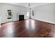 Spacious living room with hardwood floors and fireplace at 3224 Runneymede Sw St, Concord, NC 28027