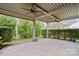 Spacious covered patio with ceiling fans and paver stones at 499 Granite Lake Ct, Denver, NC 28037