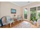 Sunroom with glass doors leading to the backyard and seating area at 499 Granite Lake Ct, Denver, NC 28037